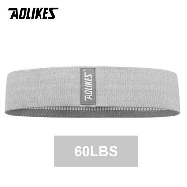 Wide pink yoga resistance band for hip and leg exercises, anti-slip fitness loop for squats and leg training, from The Clothing Company Sydney.