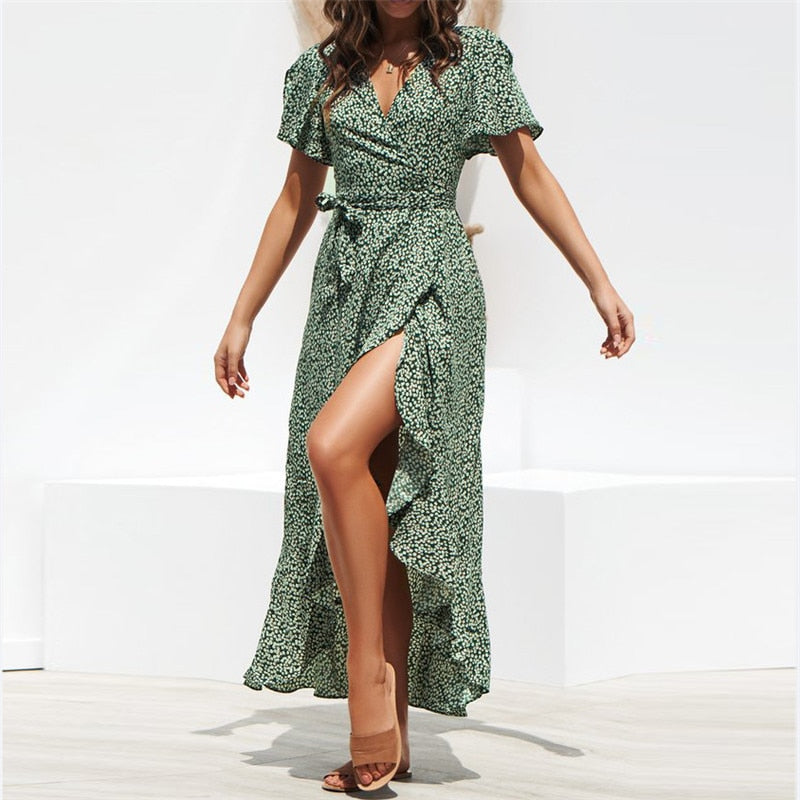 Summer beach maxi dress by The Clothing Company Sydney, floral print boho style with ruffles, V-neck, split, and wrap design.
