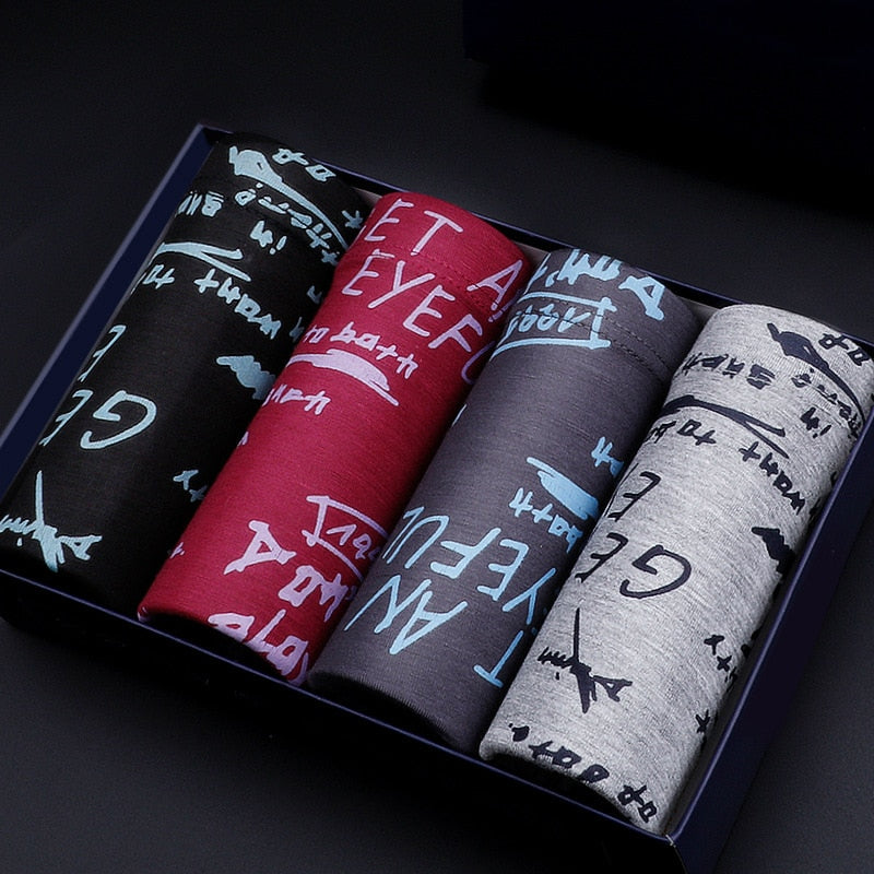 Four-pack men's breathable boxer briefs from The Clothing Company Sydney, featuring printed trunks and comfortable fit.