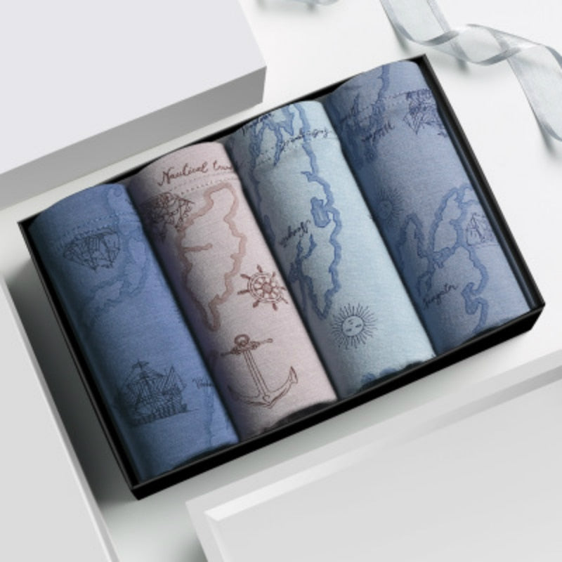 Four men's breathable boxer briefs by The Clothing Company Sydney, featuring colorful printed trunks and comfortable fit.