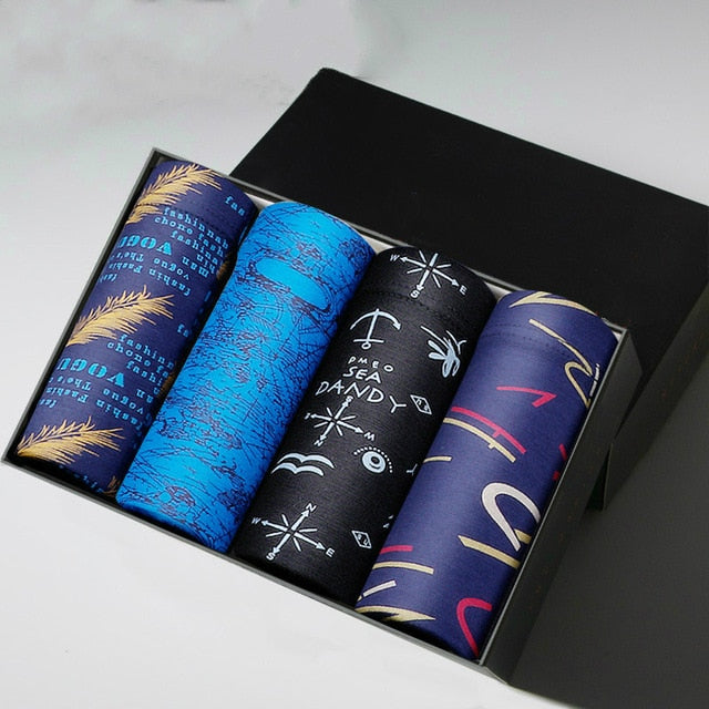 Four men's boxer briefs from The Clothing Company Sydney, breathable cotton underpants with colorful print and comfortable fit.