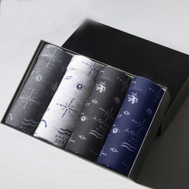 Four pairs of breathable men's boxer briefs with printed designs from The Clothing Company Sydney, comfortable trunk-style underwear.