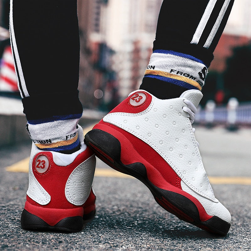 Shockproof boys' and girls' sport shoes by The Clothing Company Sydney, featuring non-slip basketball sneakers for kids.