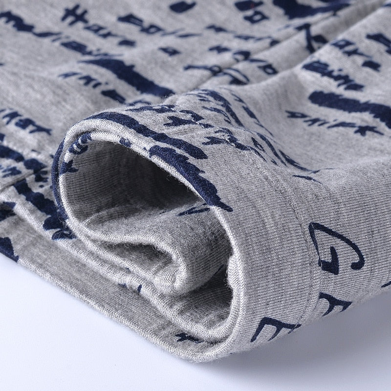 Four pairs of The Clothing Company Sydney men's boxer briefs with printed designs, breathable and soft U-convex boxer shorts.