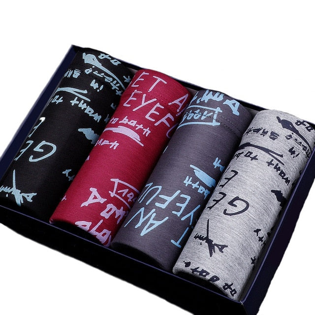 Four-pack men's boxer briefs by The Clothing Company Sydney featuring printed designs, breathable fabric, and U-convex pouch.