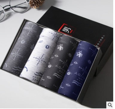 Four pairs of The Clothing Company Sydney men's boxer briefs with printed designs, breathable U convex trunks for comfort.