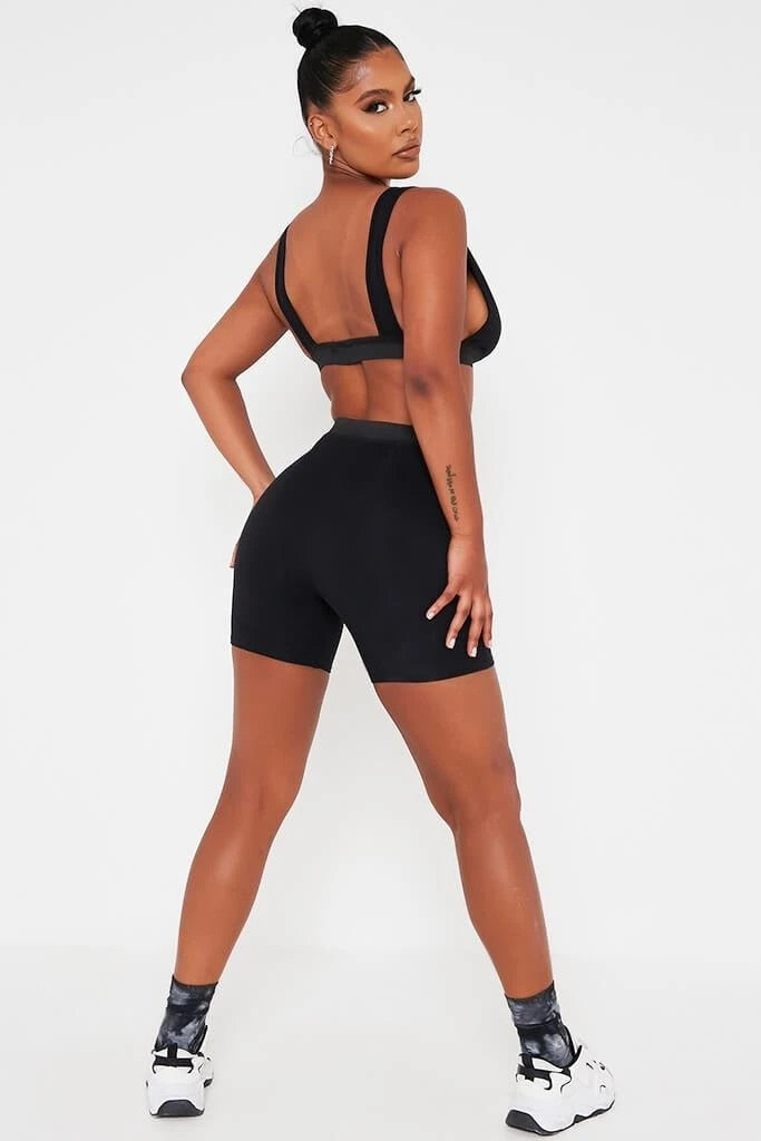 Khaki sleeveless V-neck crop top and biker shorts fitness set by The Clothing Company Sydney, backless design, casual activewear.
