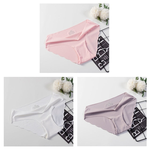 Three pairs of seamless, solid color women's briefs from The Clothing Company Sydney, showing smooth, comfortable underwear.