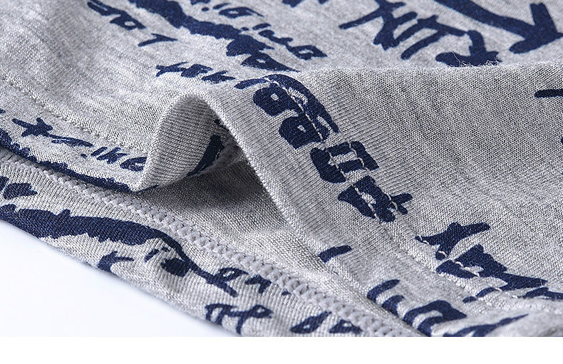 Four pairs of breathable men's boxer briefs with colorful print from The Clothing Company Sydney, comfortable trunk-style underwear.