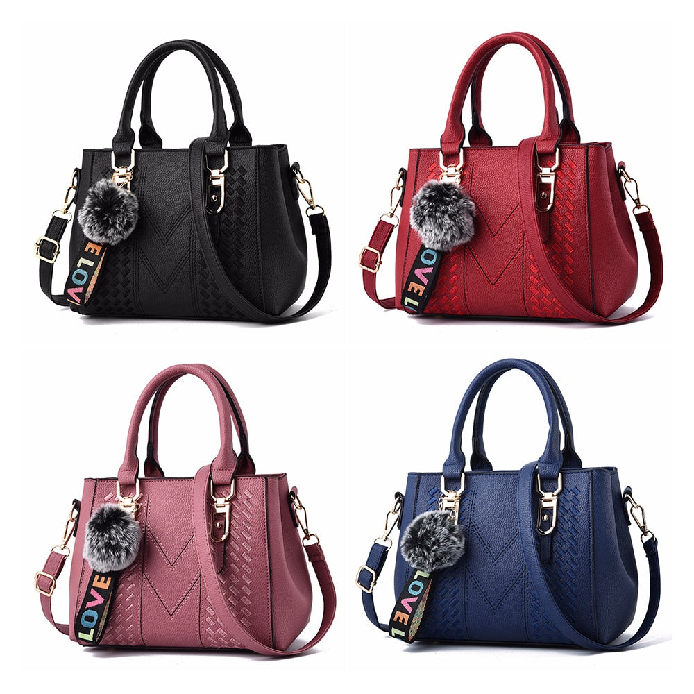 Embroidery handbag with fur ball, PU leather shoulder bag from The Clothing Company Sydney, featuring crossbody and tote styles.