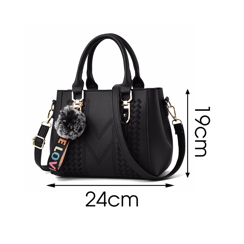Embroidery handbag with fur ball, PU leather shoulder bag, crossbody tote, designed for women, by The Clothing Company Sydney.