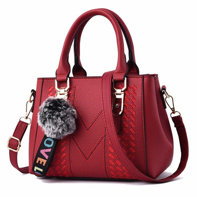 Embroidery handbag with fur ball, PU leather shoulder bag for women, crossbody tote, designer style from The Clothing Company Sydney.