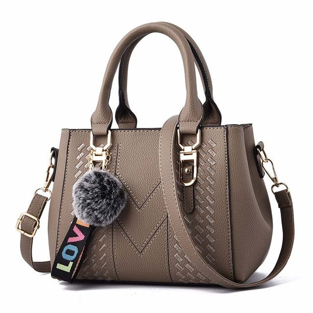 Embroidery handbag with fur ball, designer PU leather shoulder bag, crossbody tote, ideal for office and casual use.