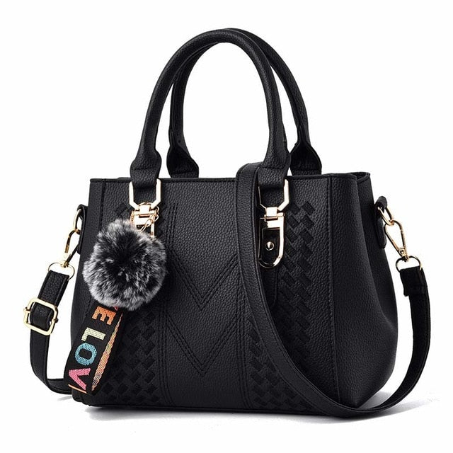 Embroidery handbag with fur ball detail, designer PU leather, shoulder strap, office crossbody style, female tote bag by The Clothing Company Sydney
