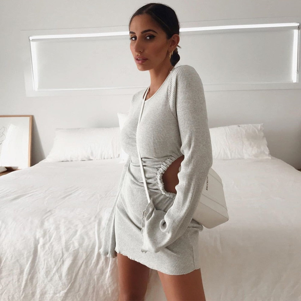Autumn chic mini dress by The Clothing Company Sydney featuring flare sleeves, cut-outs, ruched details, and a round neck.