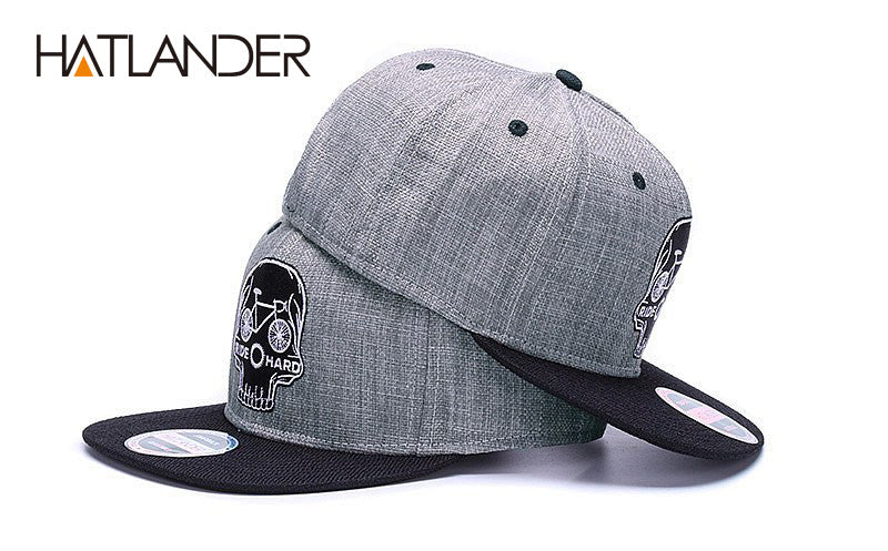 Black snapback cap with embroidered skull design, cool hip hop style, from The Clothing Company Sydney.