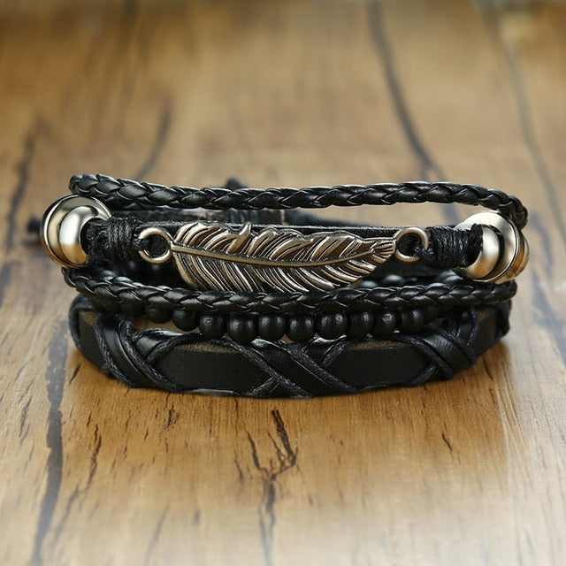 Four braided leather bracelets with wood beads, life tree charm, and tribal style elements for men, crafted by The Clothing Company Sydney.