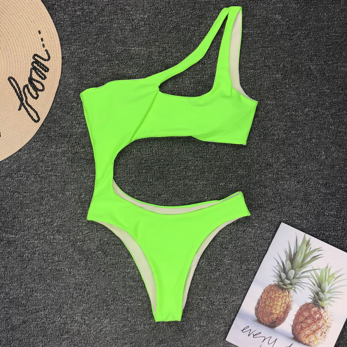 Leopard print one-piece beachwear swimsuit with single shoulder strap and midriff design by The Clothing Company Sydney.