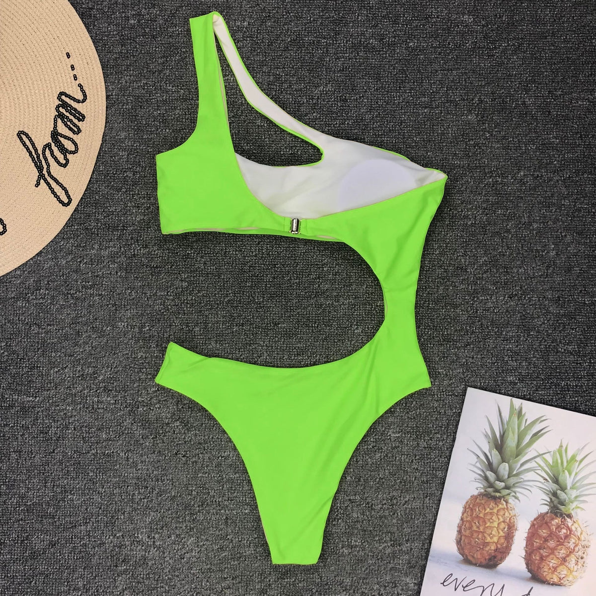 Leopard print one-piece bikini swimsuit by The Clothing Company Sydney with single shoulder strap and midriff cutout, beachwear style.