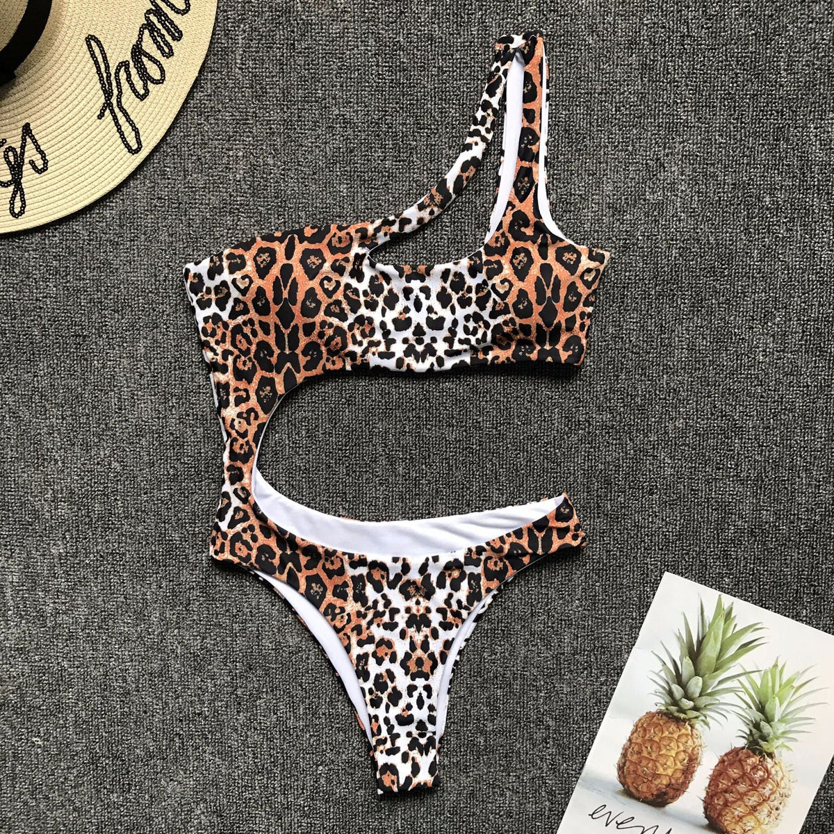 Leopard print one-piece bikini set with single shoulder strap, midriff cut, stylish swimwear by The Clothing Company Sydney.