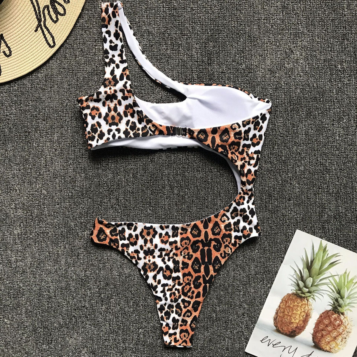 Leopard print one-piece beachwear bikini set with a single shoulder strap, midriff cut, from The Clothing Company Sydney.