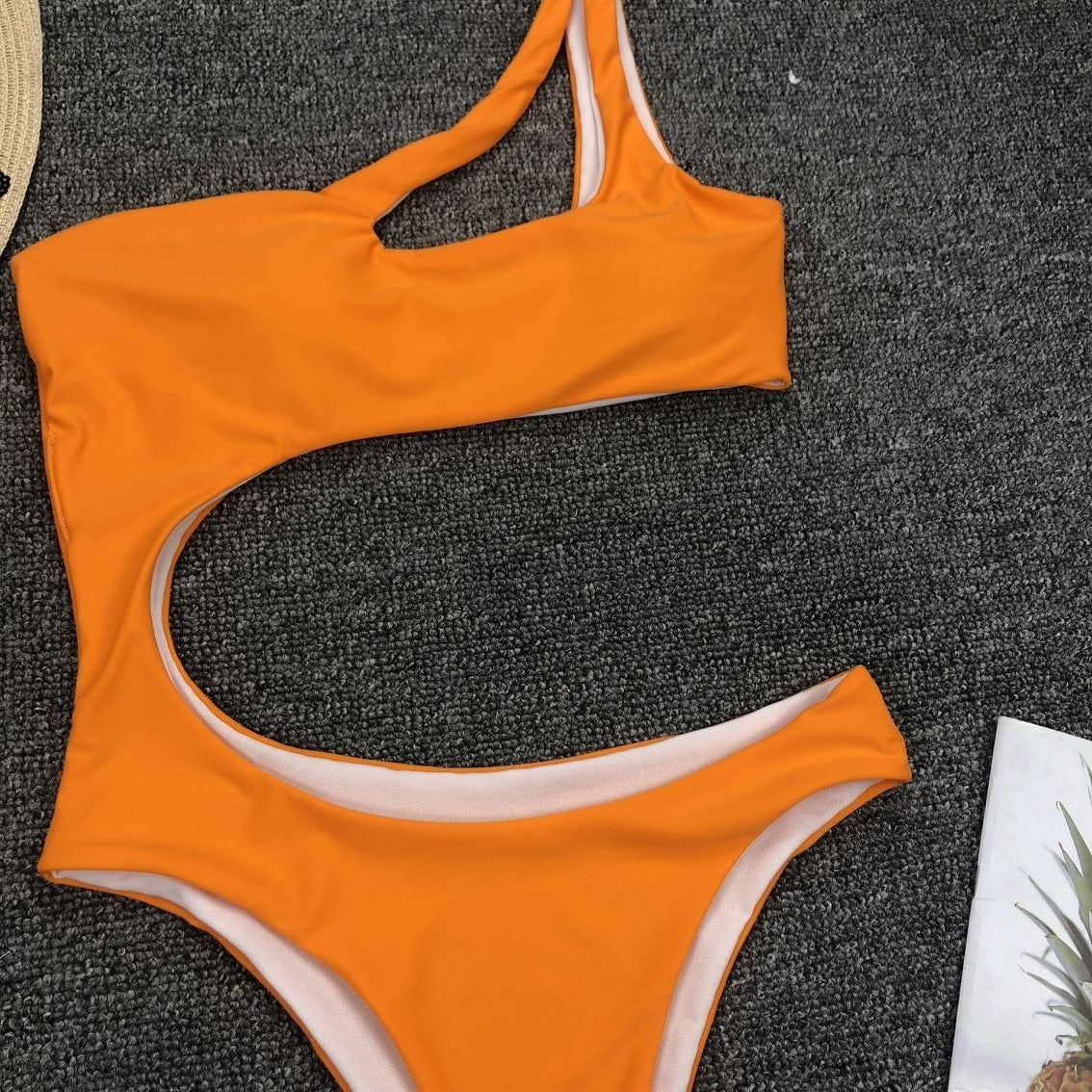 Leopard print one-piece swimsuit with single shoulder strap and midriff cut, by The Clothing Company Sydney.