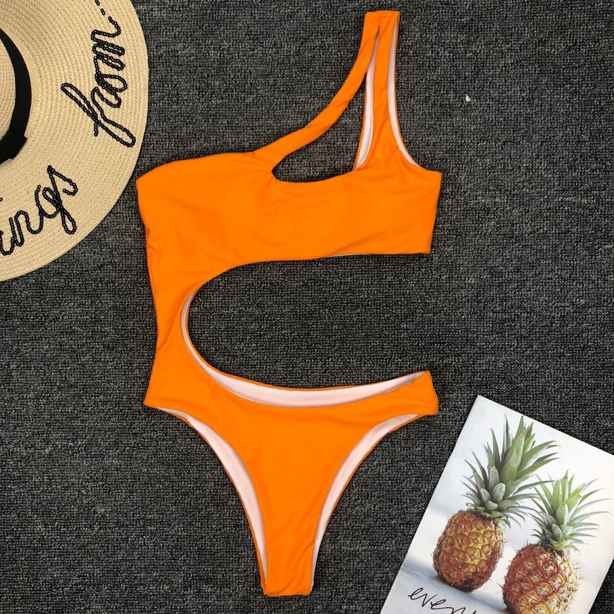 Leopard print one-piece bikini from The Clothing Company Sydney featuring a single shoulder strap and midriff cutout.