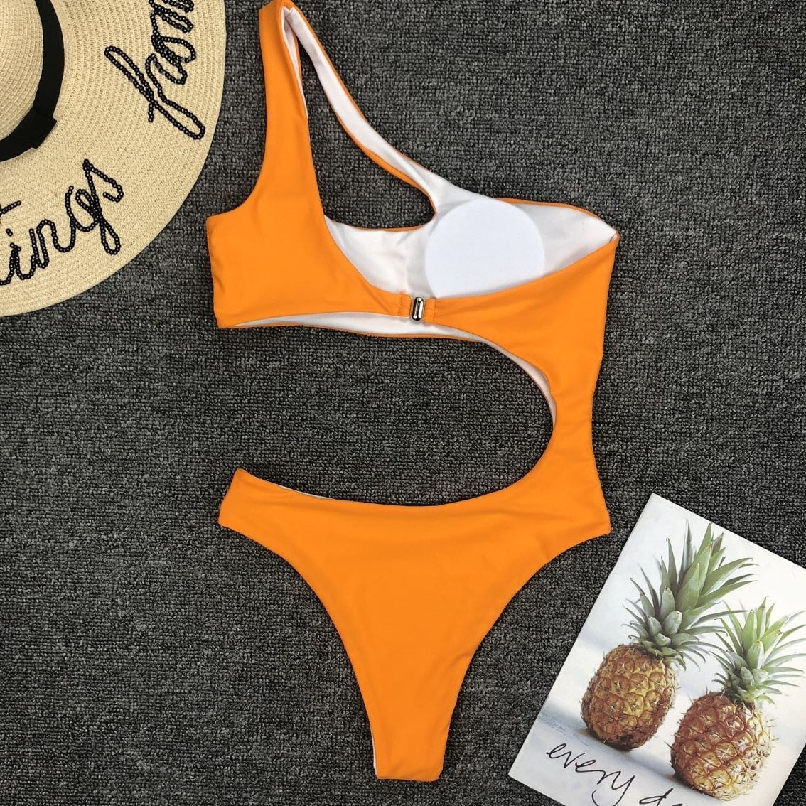 Leopard print one-piece beachwear swimsuit with single shoulder strap and midriff cut, by The Clothing Company Sydney.