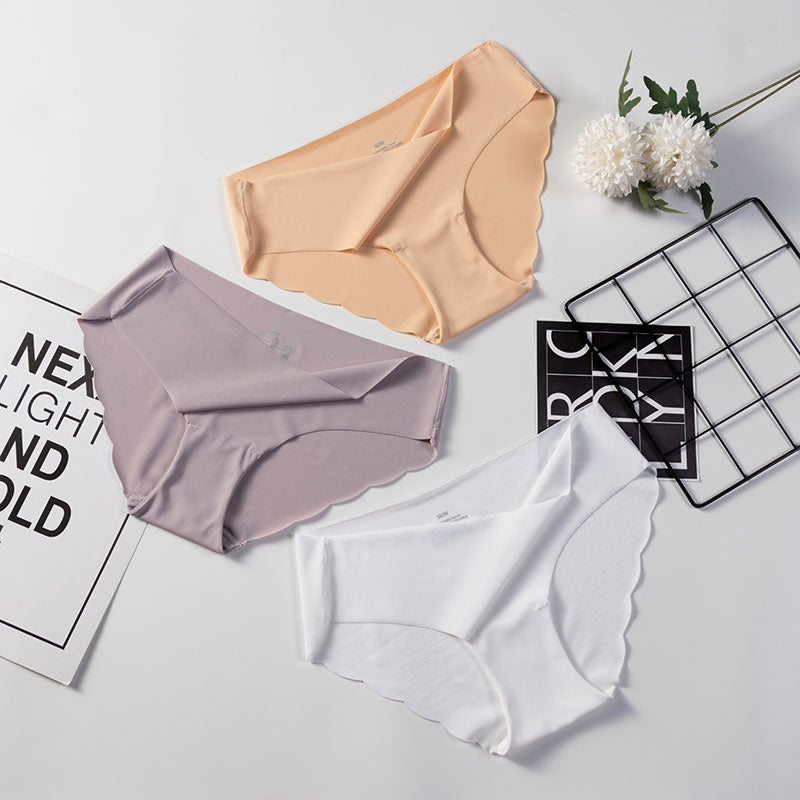 Three packs of seamless, solid-colored panties from The Clothing Company Sydney, showcasing comfortable, sexy briefs for women.