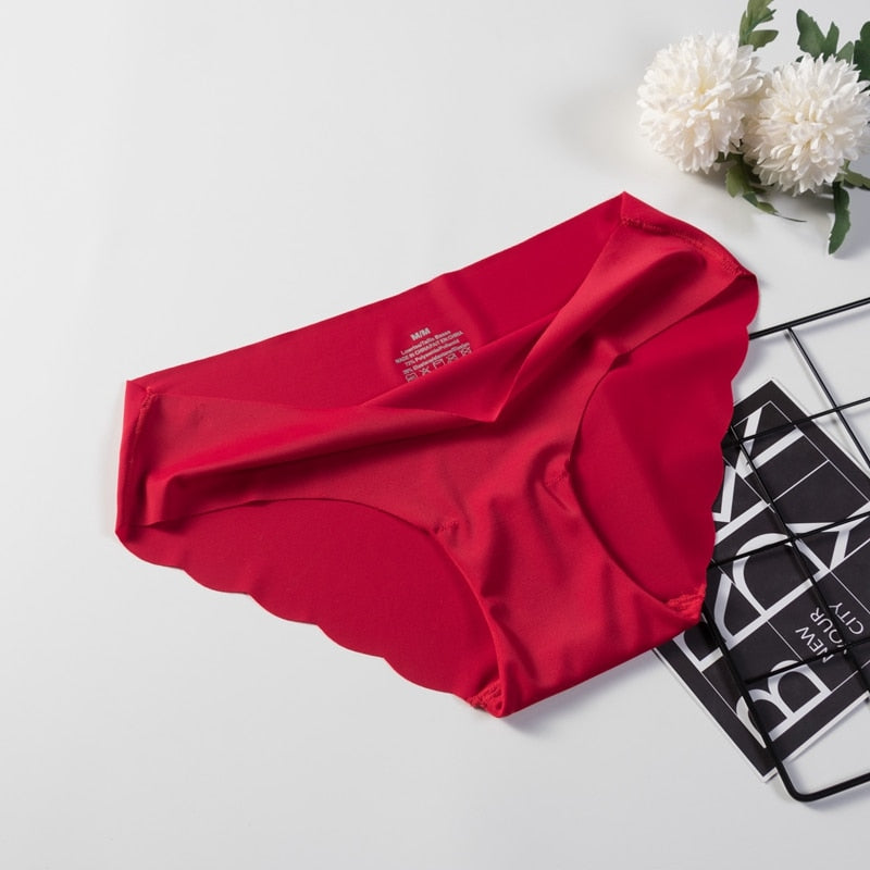 Three pairs of seamless, solid-colored briefs from The Clothing Company Sydney, comfortable and sexy lingerie underpants.