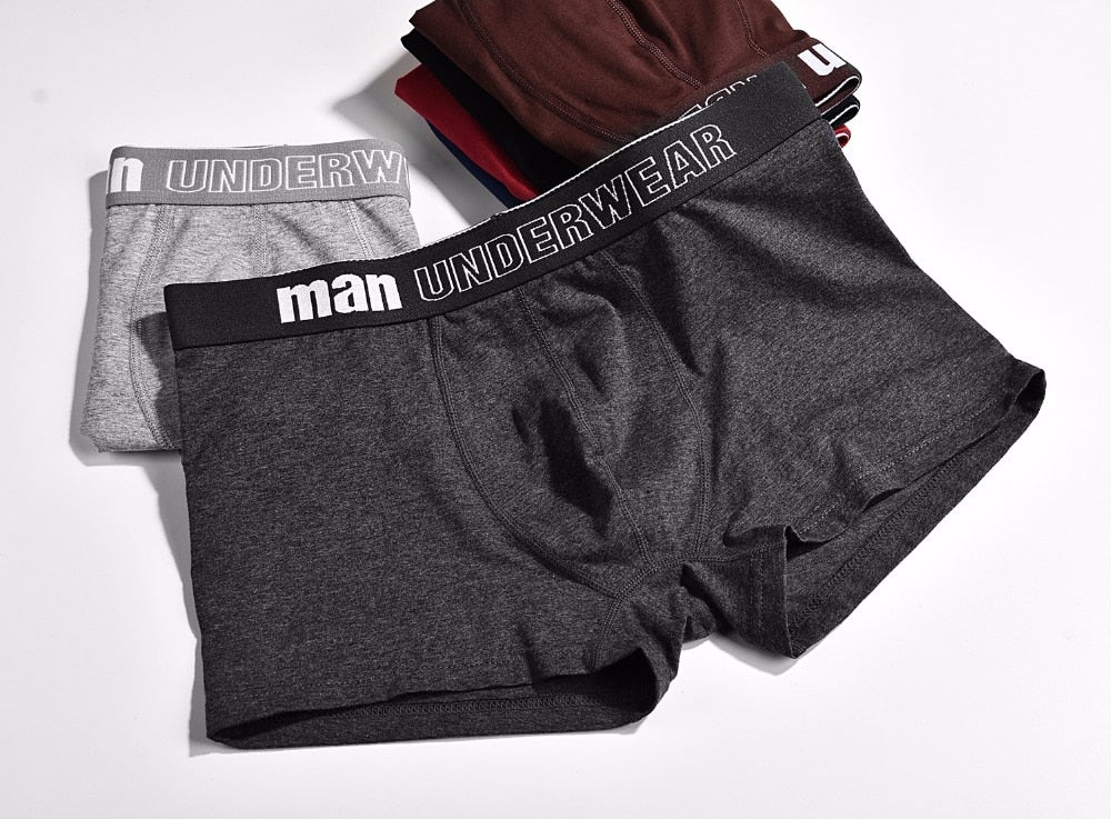 Four pairs of men's cotton boxer briefs from The Clothing Company Sydney, breathable, solid color, flexible men's underwear shorts.