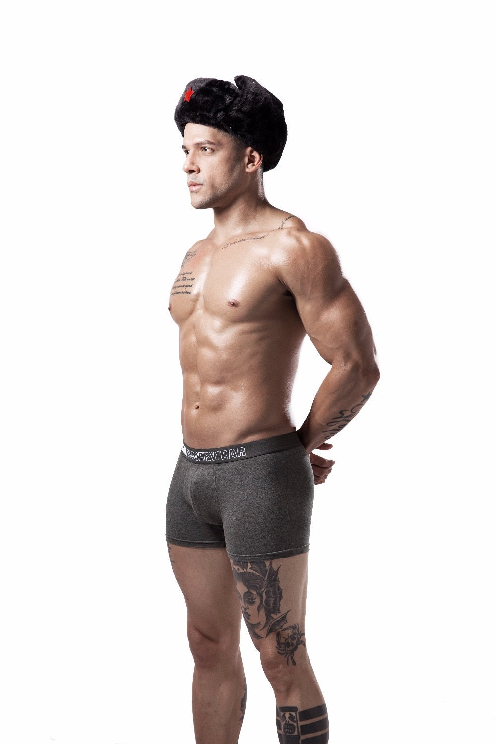 Four men's cotton boxer briefs in solid colors from The Clothing Company Sydney, featuring breathable, flexible design.