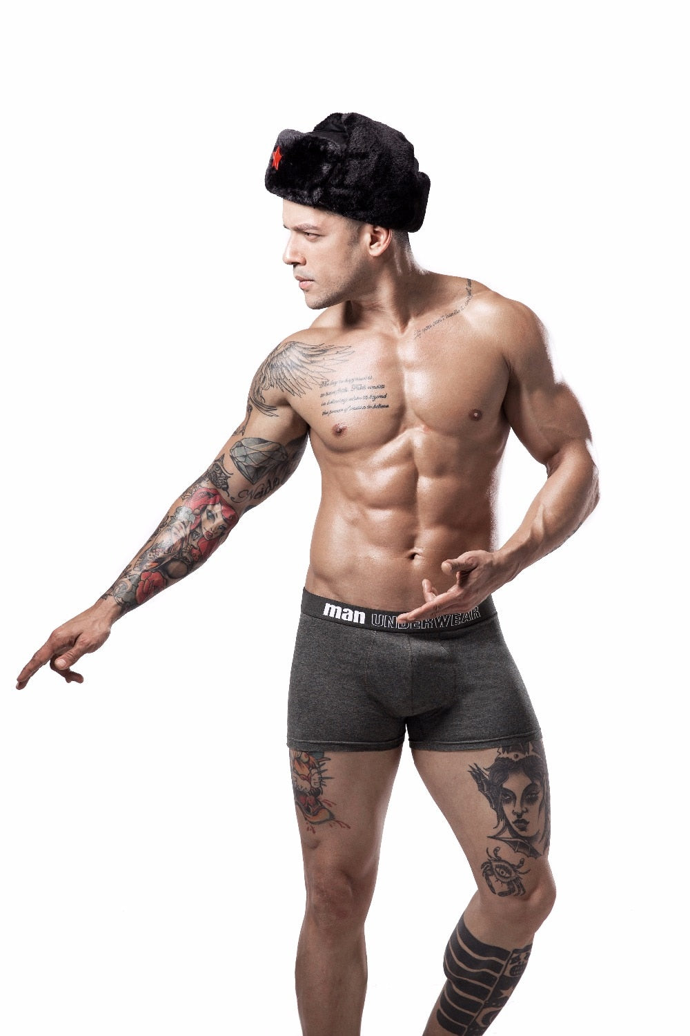 Four men's cotton boxer briefs in black, white, gray, and navy, showing flexible, breathable underpants with a snug fit.