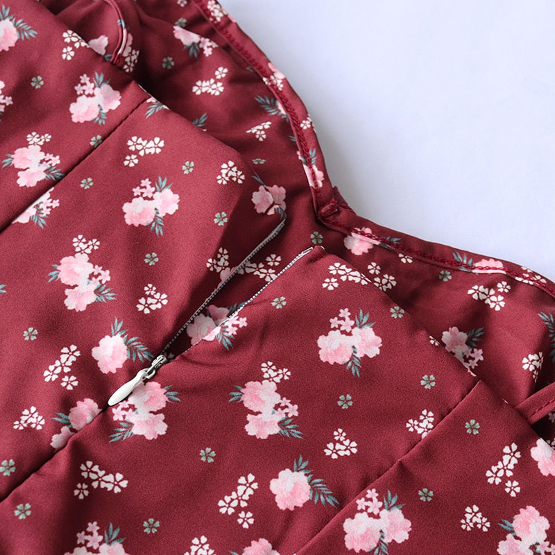 Elegant floral wine-colored women's prairie dress with spaghetti straps, backless design, lace-up side split, and draped chest.
