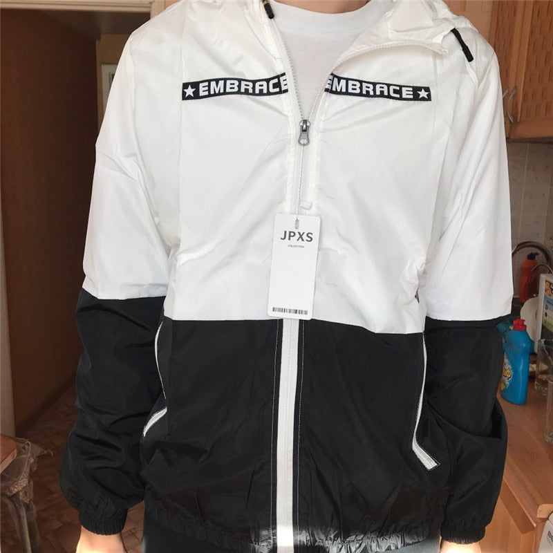 Men's all-weather casual jacket from The Clothing Company Sydney featuring patchwork design, slim fit, hood, zipper, and windbreaker style.