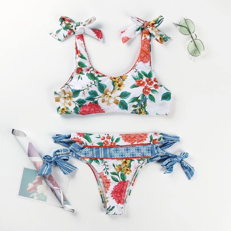 Deep V neck floral print bikini swimsuit with bow detail, lace-up design, from The Clothing Company Sydney.