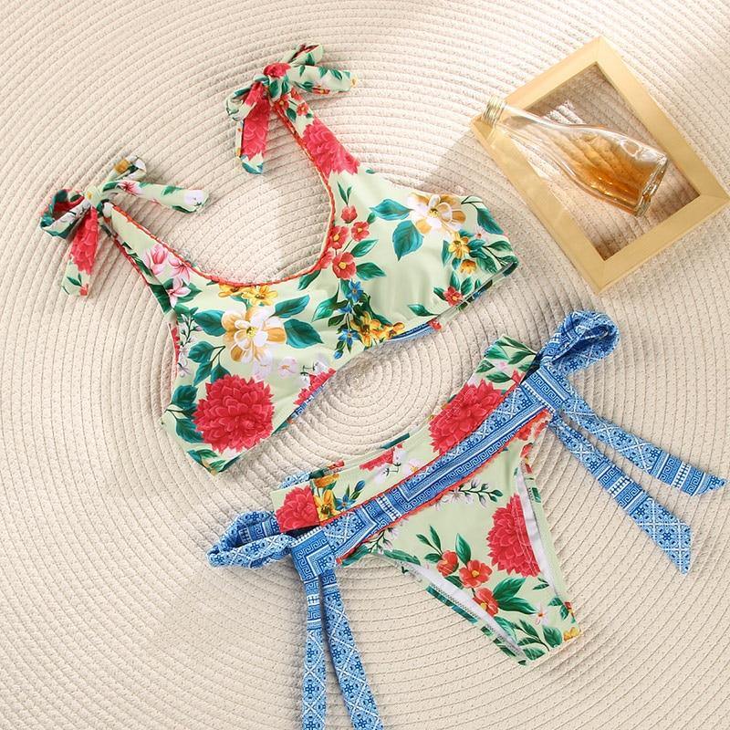 Deep V neck floral print bikini from The Clothing Company Sydney, featuring bow accents and lace-up design for stylish swimwear.