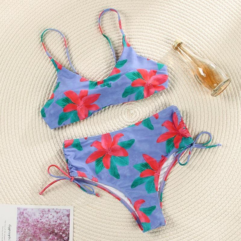 Deep V neck floral print bikini swimsuit with bow detail from The Clothing Company Sydney featuring lace-up design.