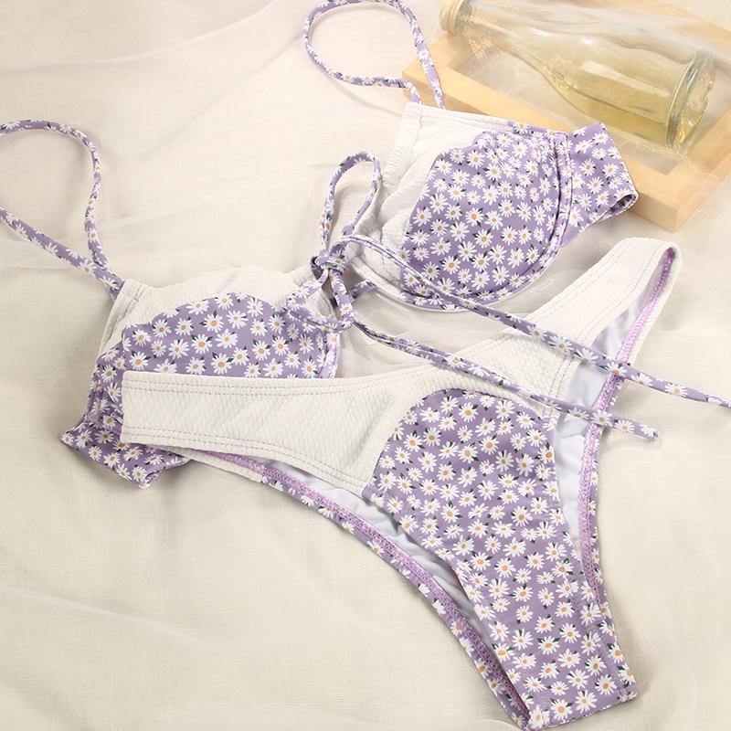 Deep V neck floral print bikini swimsuit with bow detail and lace-up design by The Clothing Company Sydney.
