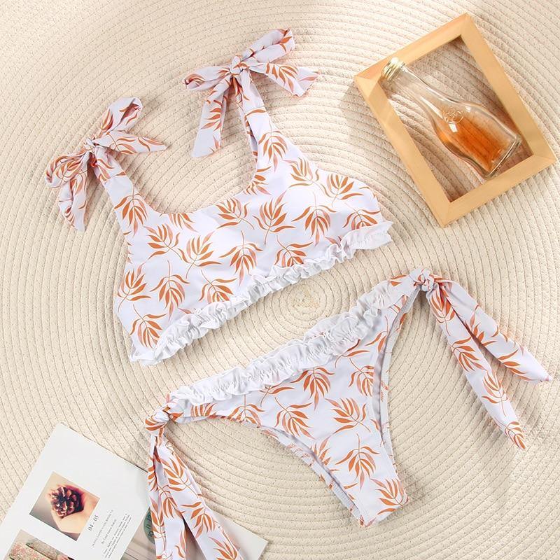 Deep V neck floral print bikini swimsuit with bow and lace-up design by The Clothing Company Sydney, showing front view.
