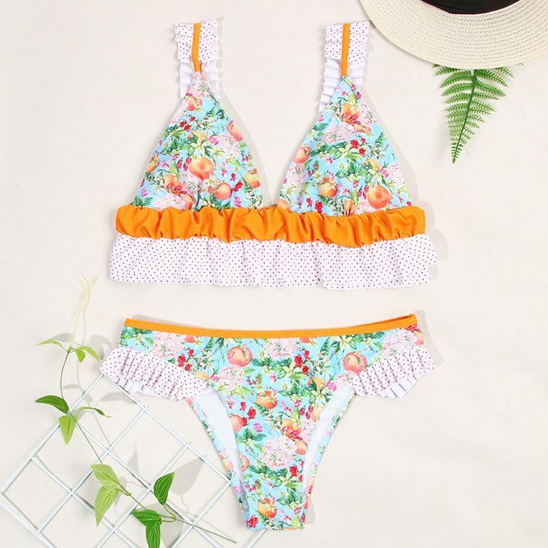 Deep V neck floral print bikini swimsuit with lace-up design and bow detail, stylish swimwear by The Clothing Company Sydney.