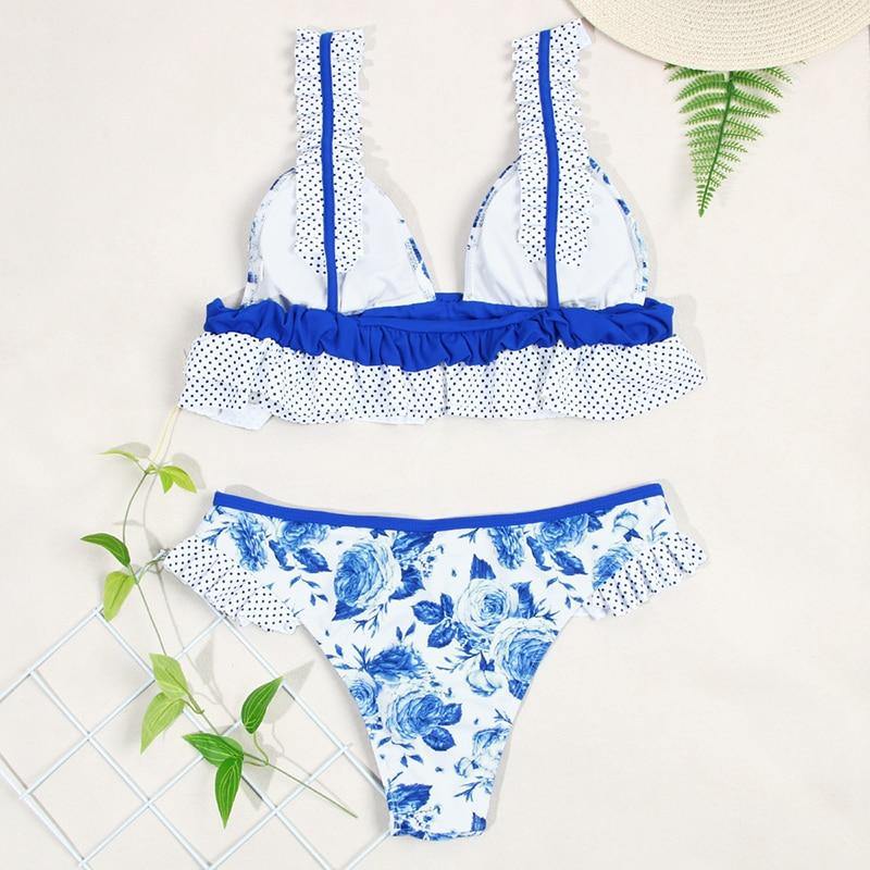 Deep V neck floral print bikini swimsuit by The Clothing Company Sydney with bow detail and lace-up design.