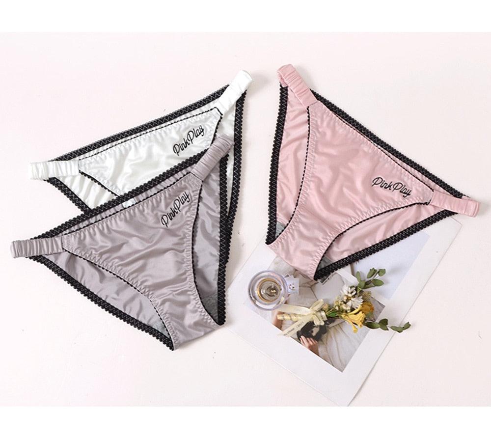 Two pairs of women's seamless letter print underwear briefs in low-rise, comfortable fashion panties by The Clothing Company Sydney.