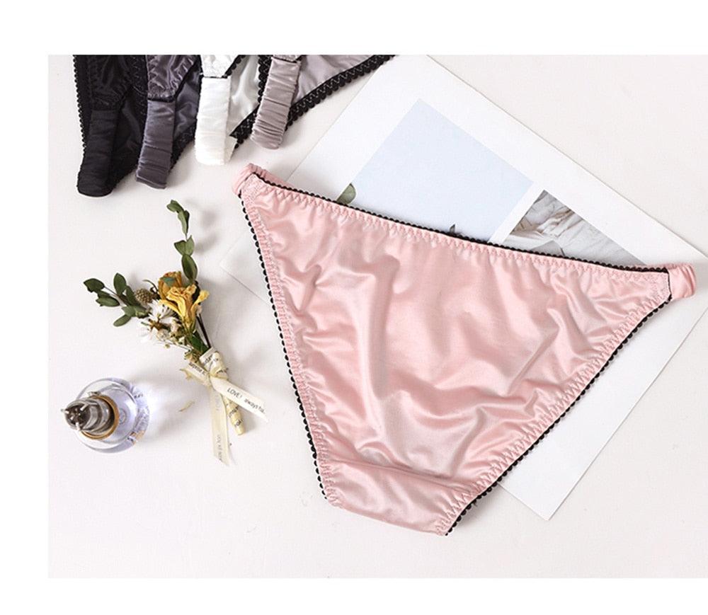 Two pairs of women's seamless low-rise underwear with letter print design from The Clothing Company Sydney, comfortable and stylish.