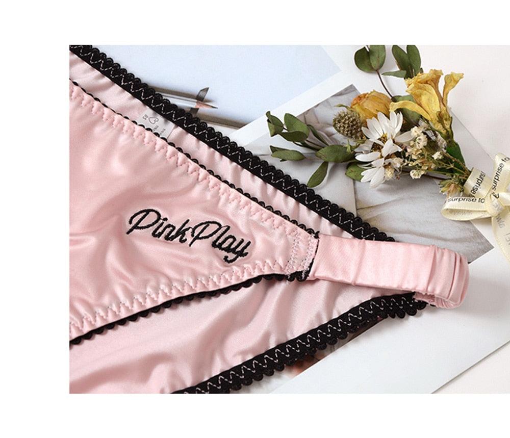 Two pairs of The Clothing Company Sydney women's seamless letter print briefs, low-rise comfort underwear, front view.