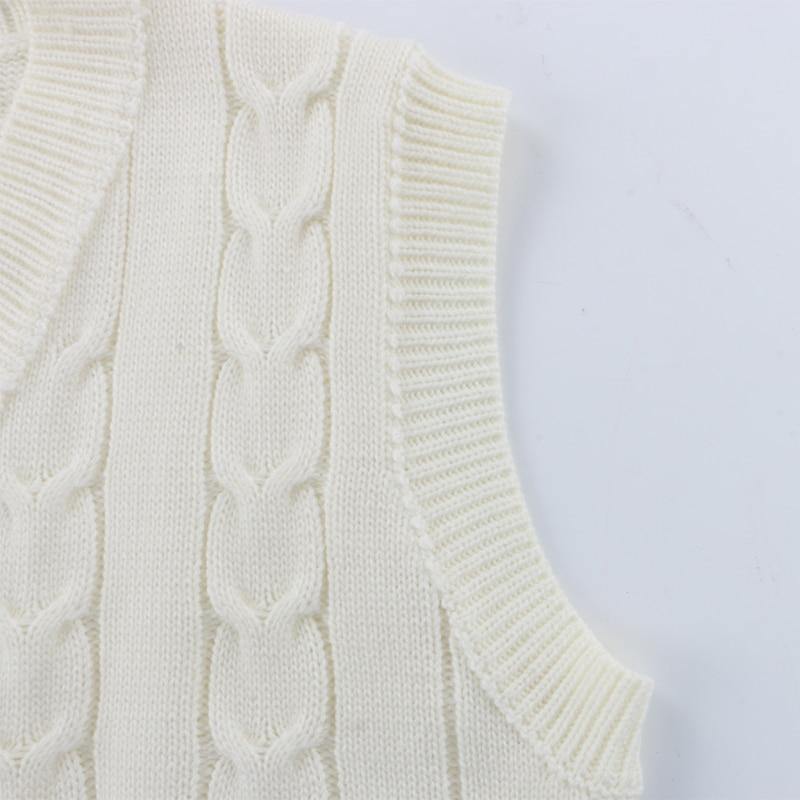 Sleeveless knitted sweater top and matching shorts mini set in neutral tones, casual autumn-winter outfit, oversized jumper style.