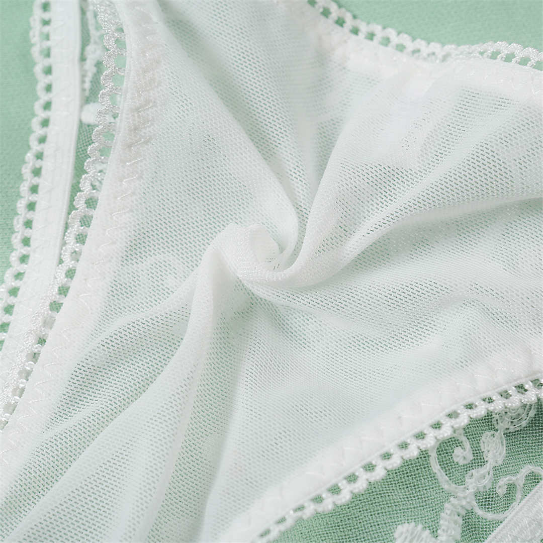 White embroidery lingerie set with underwire bras and half cups, featuring a stylish and comfortable design from The Clothing Company Sydney.