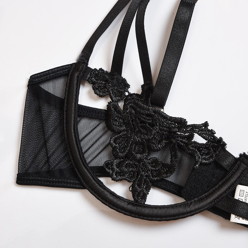 Black 2-piece transparent lingerie set by The Clothing Company Sydney with hollow-out bra and g-string briefs.