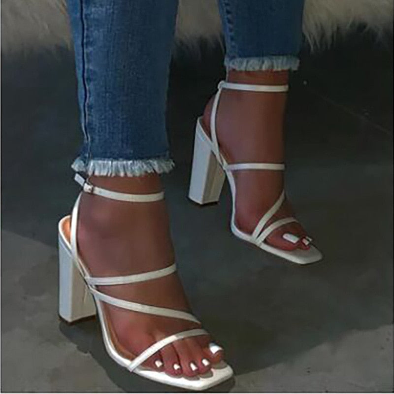 White, pink, and beige block heel women's sandals with high heels and open toes, stylishly designed by The Clothing Company Sydney.