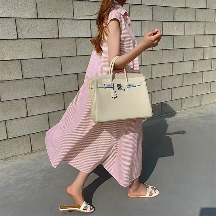 Casual sleeveless striped shirt dress in multiple colors, oversized fit with lace-up front, by The Clothing Company Sydney.
